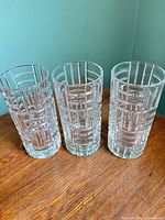 All three tumblers standing on wooden surface