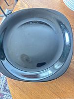 Single black dinner plate top view