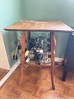 Full view of wine table showing wood top, legs, and bottle rack