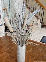 Full view of ceramic vase with artificial arrangement