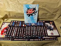 Folder standing, cards fanned beneath