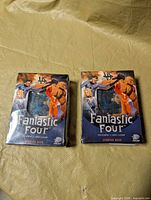 Front view of two sealed Fantastic Four TCG starter deck boxes