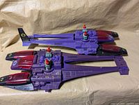 Two identical purple G.I. Joe Cobra Sea Ray vehicles side by side