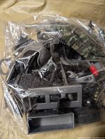 Bag showing assorted miniature military accessories