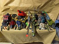 Overall view of entire lot of vehicles, parts, accessories and figures
