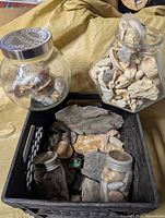 Overview of crate, large round jar, hexagonal jar and two small jars