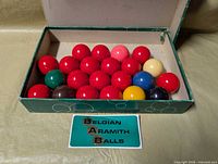 Open box displaying all billiard balls