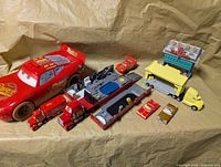 Group shot of all Cars vehicles and playset parts