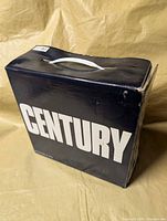 Front of cardboard carry case showing overall condition