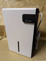 front angled view showing housing and reservoir window