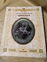 Front cover of Essentials rulebook shrink-wrapped