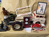 Group shot showing Marx truck, license-plate frame, clocks, fire engines, figurine, drinkware, pager, awards