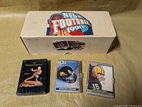 Long white factory box labeled NFL Football 1991 with three smaller card sets in front