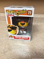 Front view of boxed Funko Pop Chester Cheetah #77