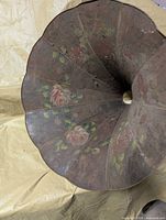 Interior of horn showing rose paintings on multiple panels