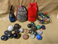 Full lot showing all bags, tub and loose shooter marbles