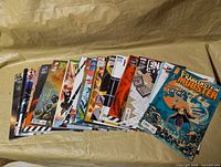 Full stack of 30 comics fanned out on table