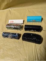 Five lipstick cases displayed