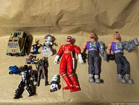 Full lot overview showing figures and vehicles on surface