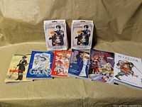 Front view showing six manga books and two sealed card-game boxes