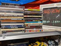 Overall view of both CD stacks and framed Skid Row glass picture