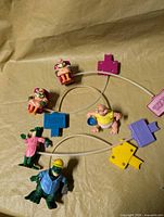 Overview of all five Dinosaurs figures connected by clear tubing to coloured pumps