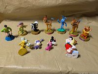 Group shot of all Disney figurines laid out