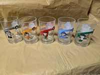Front view of five McDonald's Beijing 2008 Olympic glasses displaying mascots