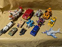 Group shot of all Transformers vehicles and parts