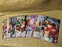 Fanned display of all 30 DC comics