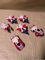 Top view of six McDonald's Transformers vehicles