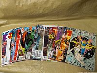 Front view showing 30 bagged DC comic books fanned out