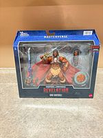 Front of sealed box showing figure and accessories