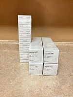 Stacked individual boxes of Baseline Invisible Tape