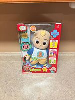 Front view of boxed CoComelon Boo Boo JJ plush toy