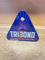Front of triangular Tribond tin
