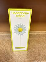 Front of boxed daisy headphone stand