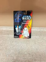 Front view of sealed Princess Leia Organa action figure on card