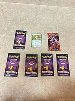 Group view of Eevee promo card, Destined Rivals booster, five Trick or Trade packs