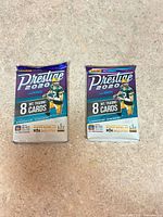 Front of both sealed 2020 Panini Prestige NFL trading card packs