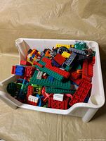Top view of white bin filled with assorted LEGO pieces