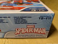 Retail box showing Marvel Spider-Man branding, adjustable size Y8-Y11 information
