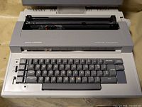 Front view of Smith-Corona Sterling Electronic typewriter showing keyboard and carriage