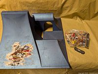 Overall lot showing ramp, sealed bag of fingerboards and loose board