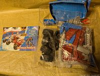 Instruction booklet and loose bricks in plastic tray