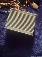 Finned silver aluminum motor housing with wiring harness