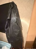 Jacket front view hanging, showing overall style and leather exterior