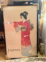 Full view of framed geisha painting showing size, frame, and JAPAN text