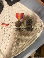 Overall view of all four items on white crocheted background