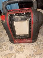 Front view of Mr. Heater Portable Buddy showing handle, burner tile, control knob